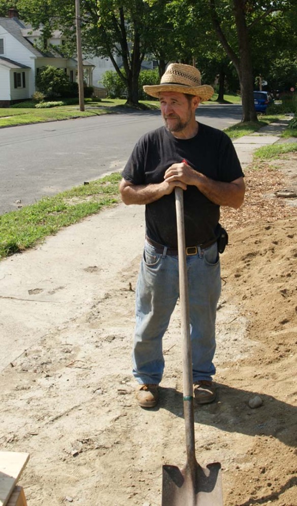 John S. posing with shovel